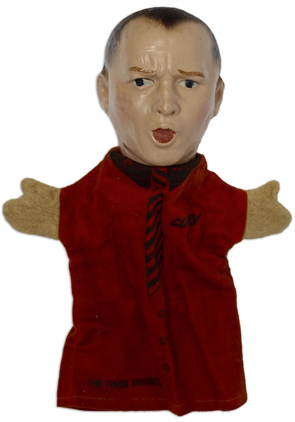 Curly Howard Hand Puppet, Circa 1937 -- With Painted Composite Head & Felt Hands & Shirt, Measuring 11'' Tall x 8'' Across -- Crack to Paint at Top of Head, Otherwise Near Fine -- Very Rare